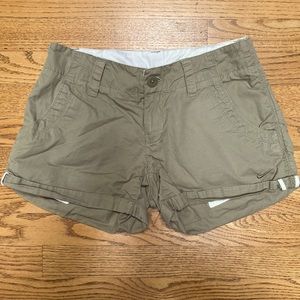 Nike khaki style shorts with button & zipper.